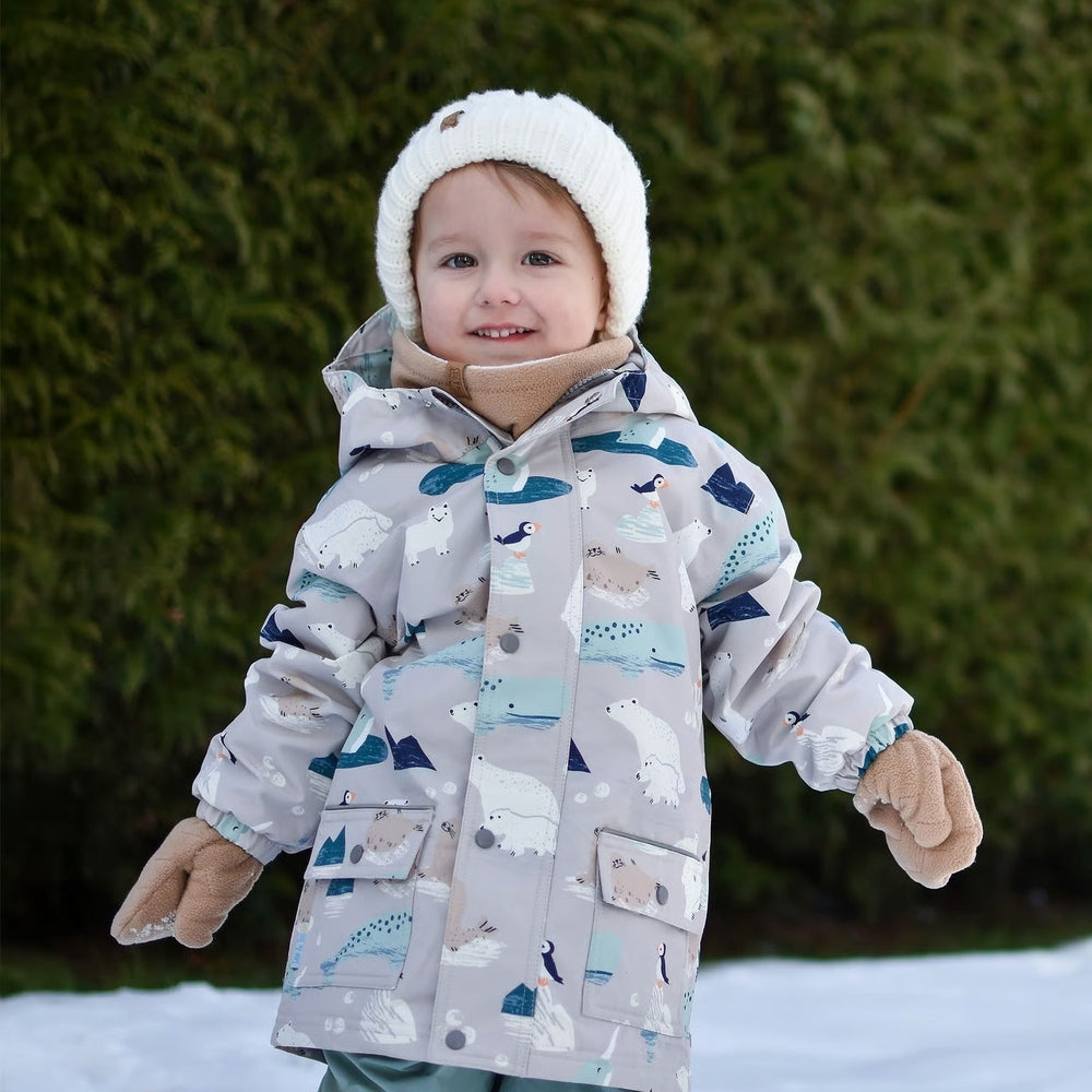 JAN & JUL kids fleece neck warmer in soft brown, worn by toddler with white knit hat and coat