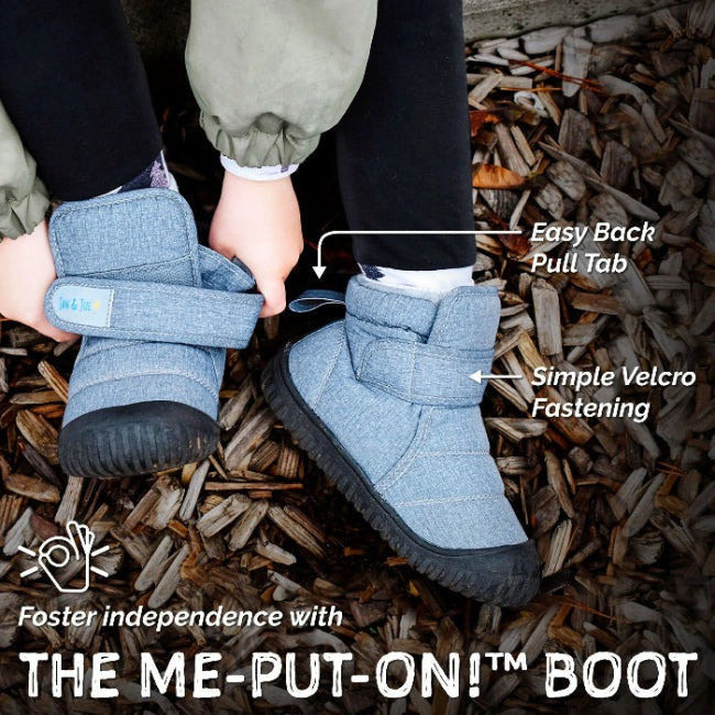 Jan & Jul Kids Insulated Ankle Boots Dusty Blue, being worn by a child to show Velcro fastening and easy-back pull tab.