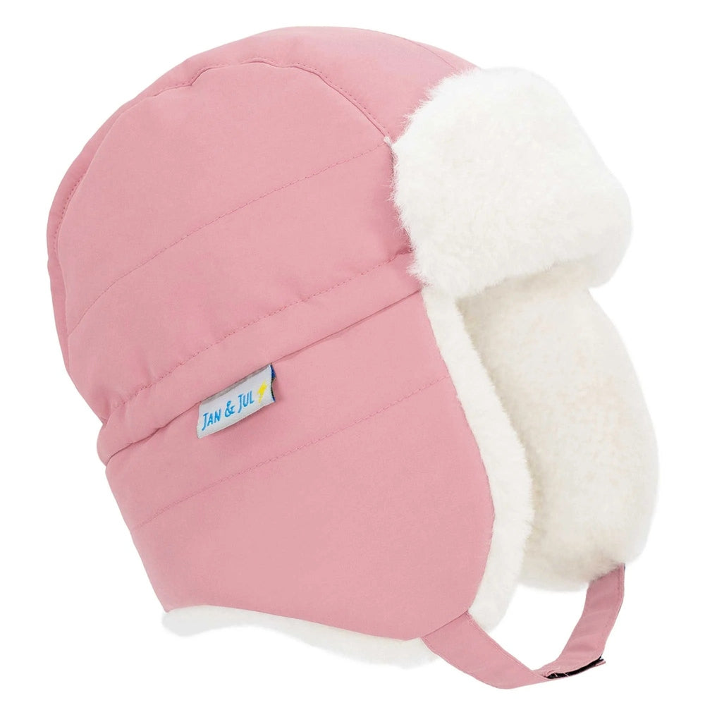Jan & Jul Kids Insulated Winter Hats Dusty Pink shown from side with white plush ear flaps and cozy lining.