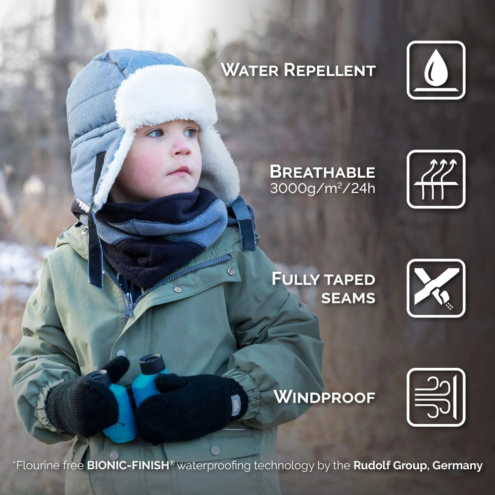 JAN & JUL Space Dinos insulated winter hat on a child outdoors in blue with white faux fur trim, windproof.