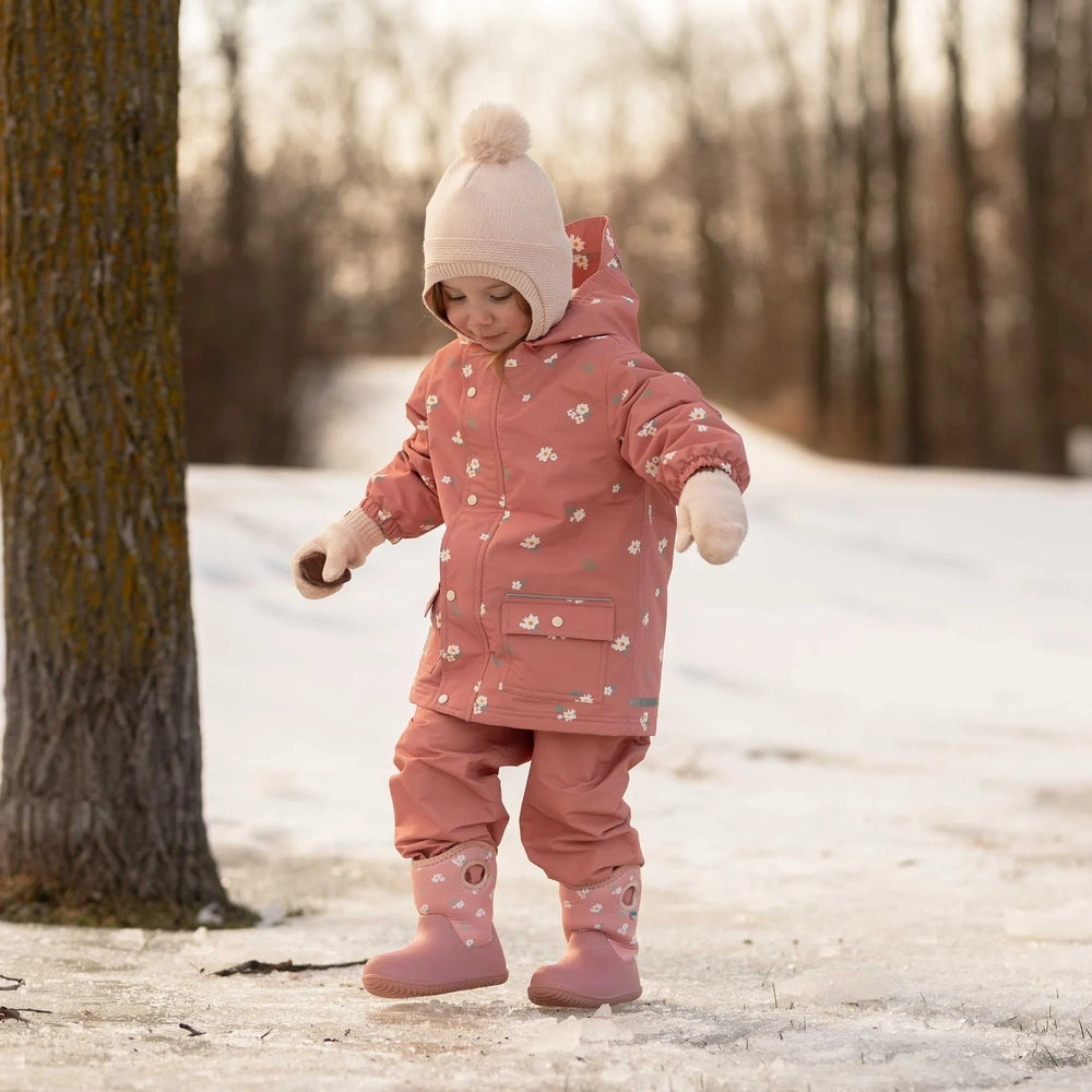Jan & Jul Lite Waterproof Boots Apricot Flower for toddlers; pink waterproof boots with white floral pattern worn by a child in a snowy park.