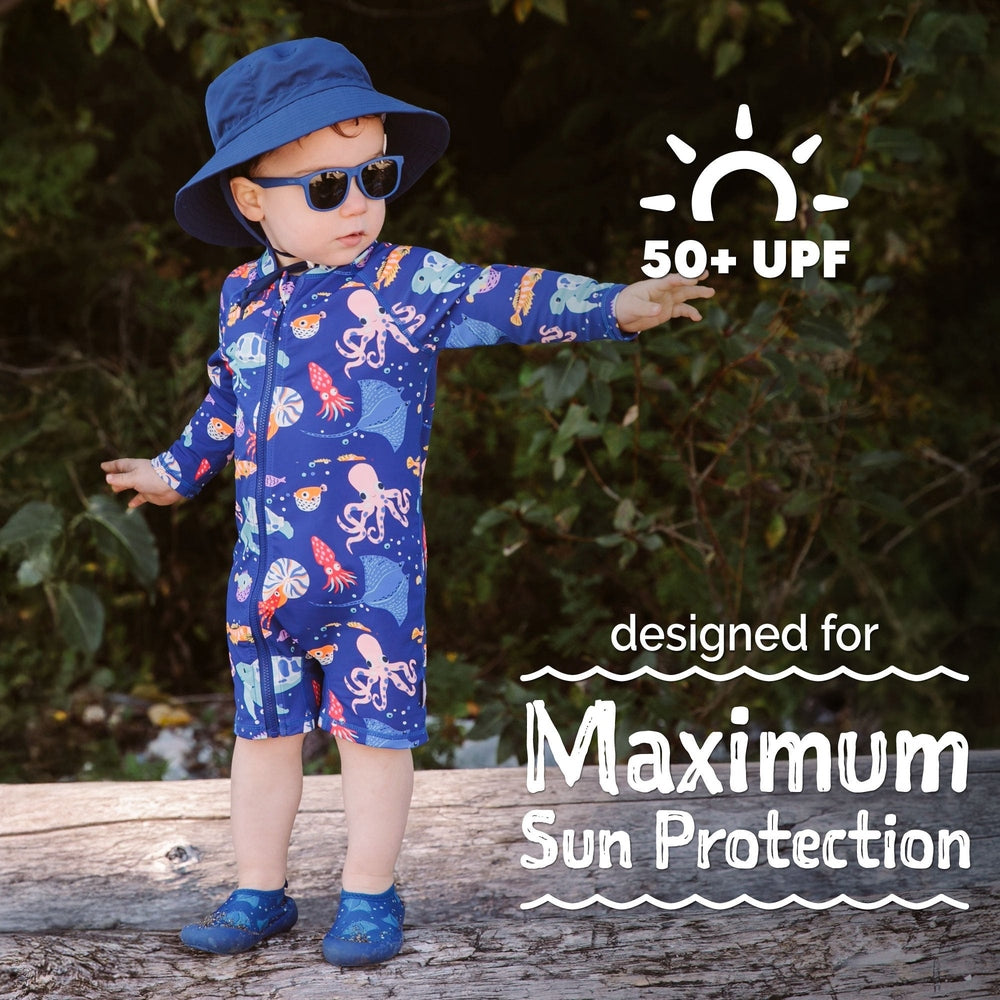 JAN & JUL Kids One Piece UV Sun Suit Sea Friends in blue, on toddler with hat and sunglasses, showing UPF 50+ protection