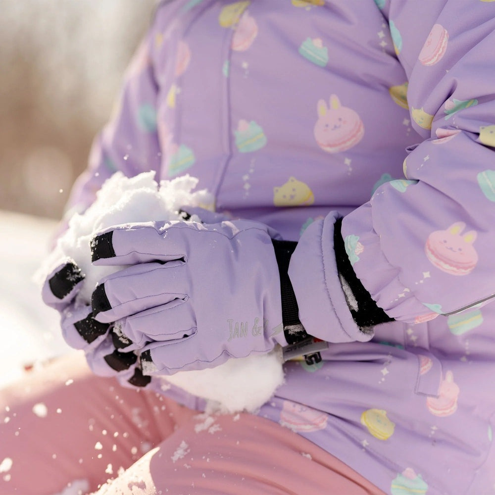 Jan & Jul Kids Waterproof Snow Gloves in lavender, shown squeezing fresh snow with black-tipped fingers.