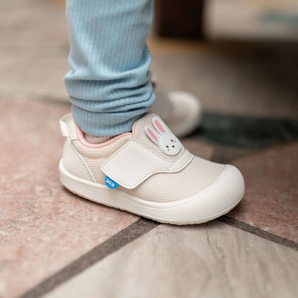 Jan & Jul Mini-Flyer toddler sneakers in cream with bunny applique and Velcro strap