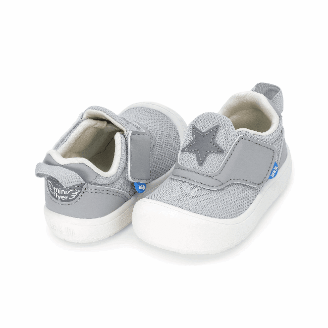 Jan & Jul Mini-Flyer toddler sneakers, pair in silver with star patch and Velcro straps.