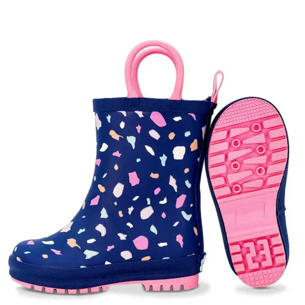JAN & JUL Puddle Dry Rain Boots Terrazzo navy with pink handles and sole, shown upright with treaded pink outsole visible
