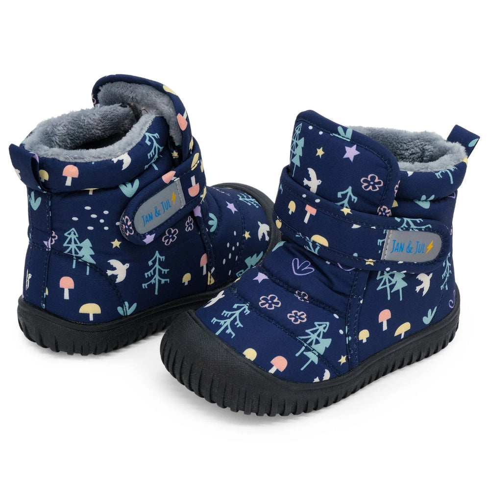 Jan & Jul Toasty Dry Booties Navy Forest pair, showing plush lining, rugged soles, and Velcro straps securing the boots.
