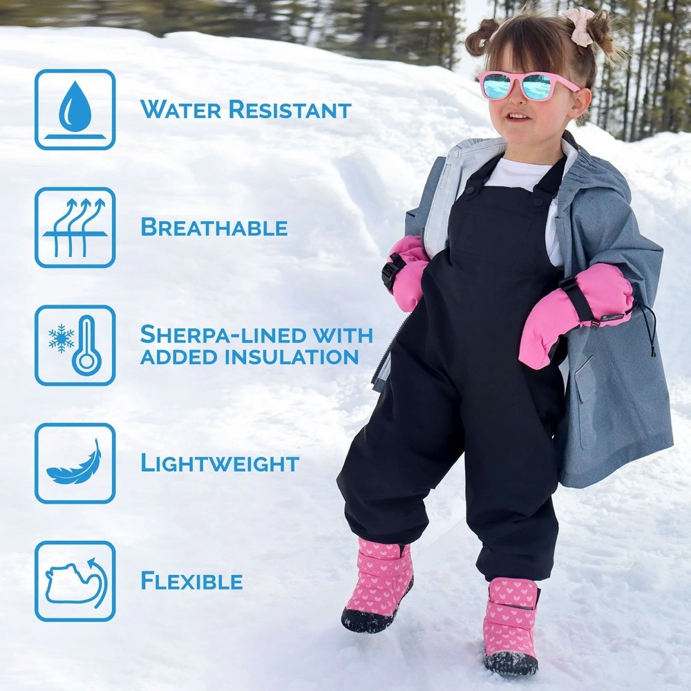 JAN & JUL Toasty Dry Booties Navy Forest worn by a toddler in pink mittens on snowy ground, water-resistant insulated boots.