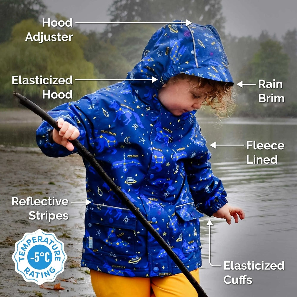 JAN & JUL Waterproof Cozy Dry Rain Jacket in blue with fleece lining, reflective stripes and elastic cuffs, worn by a child in rain