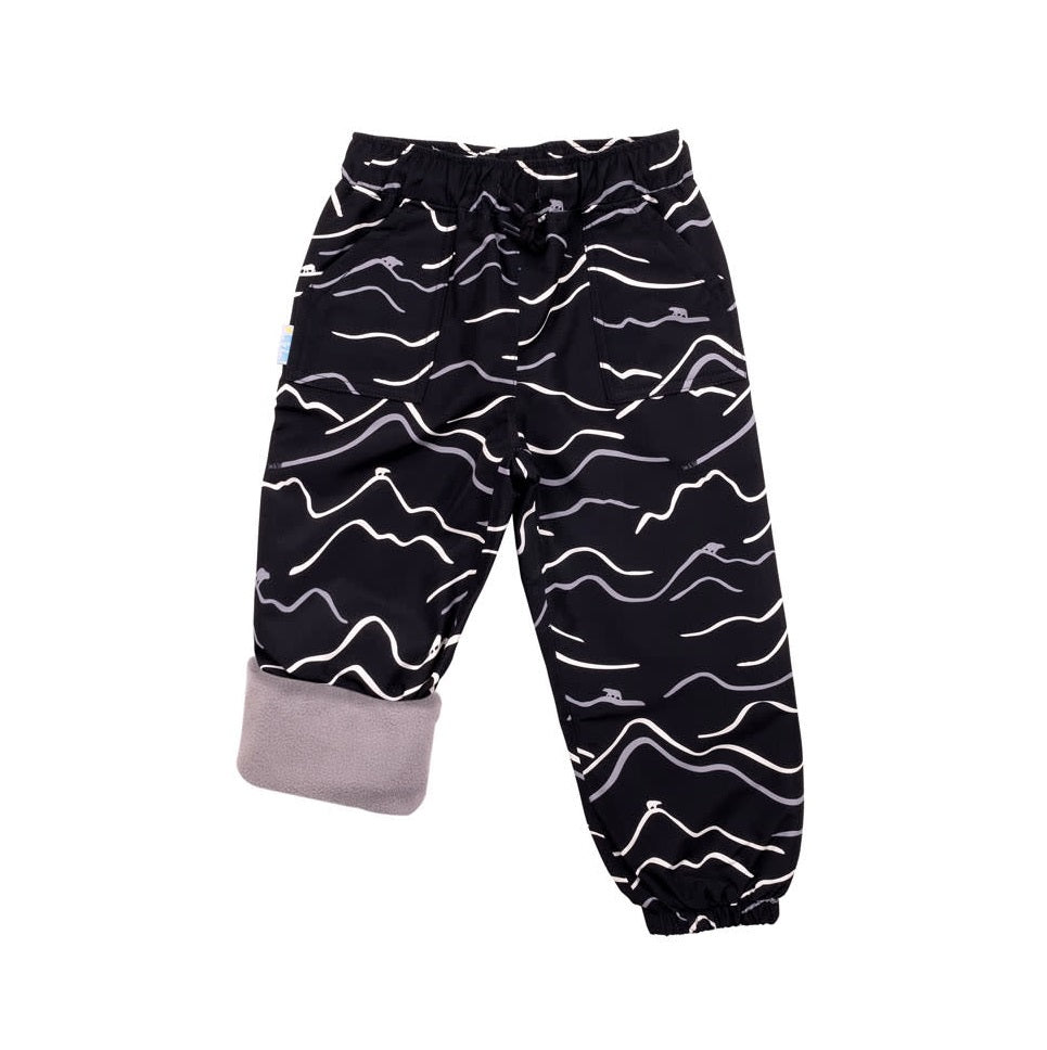 Jan & Jul Bear Mountain rain pants, black with white wavy print, cuffed gray interior