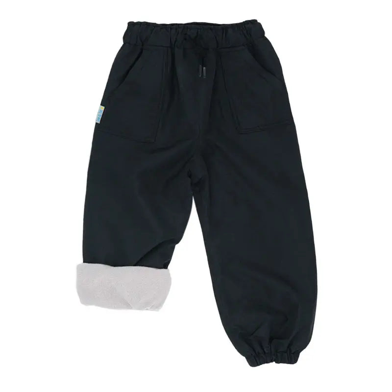 Jan & Jul Waterproof Cozy Dry Rain Pants Black with fleece-lined cuffs; rolled-up leg shows warm interior.