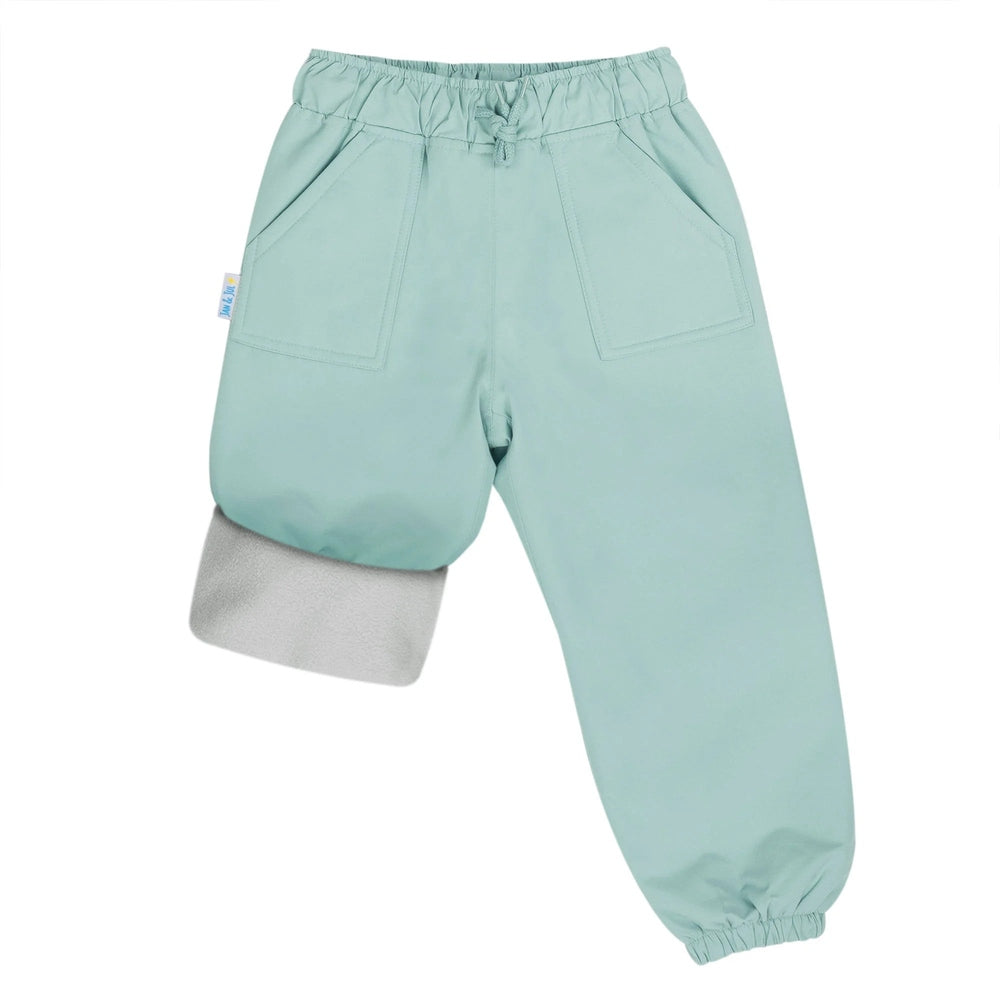 JAN & JUL Waterproof Cozy Dry Rain Pants Dusty Mint; elastic waist, front pockets, leg turned up to show waterproof lining.