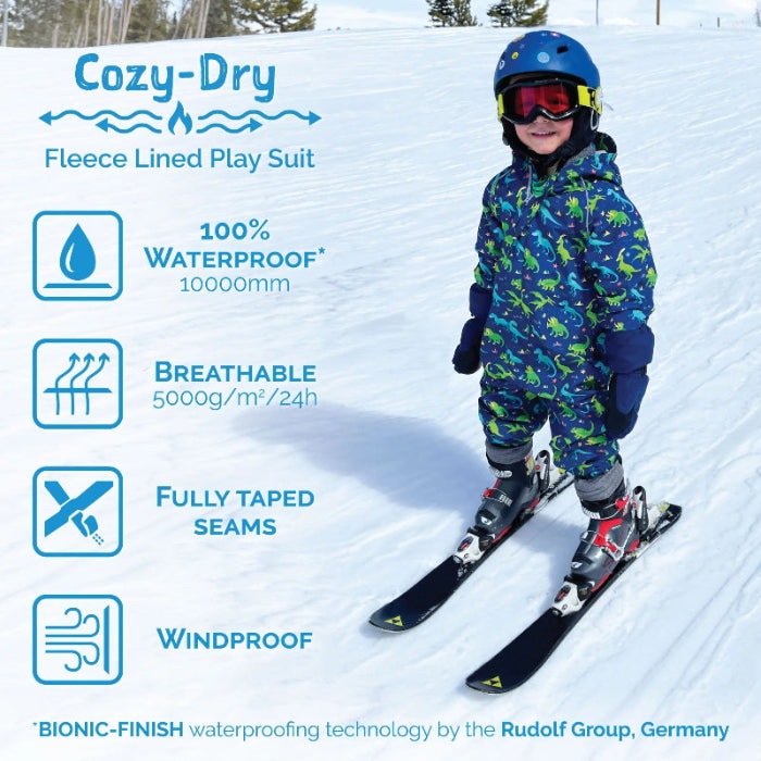 JAN & JUL Cozy Dry Rain Suit Enchanted in blue dinosaur print; child skis on snow, 10000mm waterproof with taped seams.