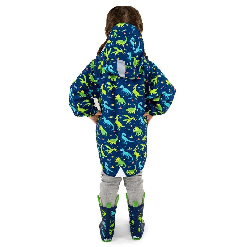 Jan & Jul Waterproof Puddle Dry Rain Jacket Dinoland worn by a toddler with hood up, blue with neon green dinosaur print.