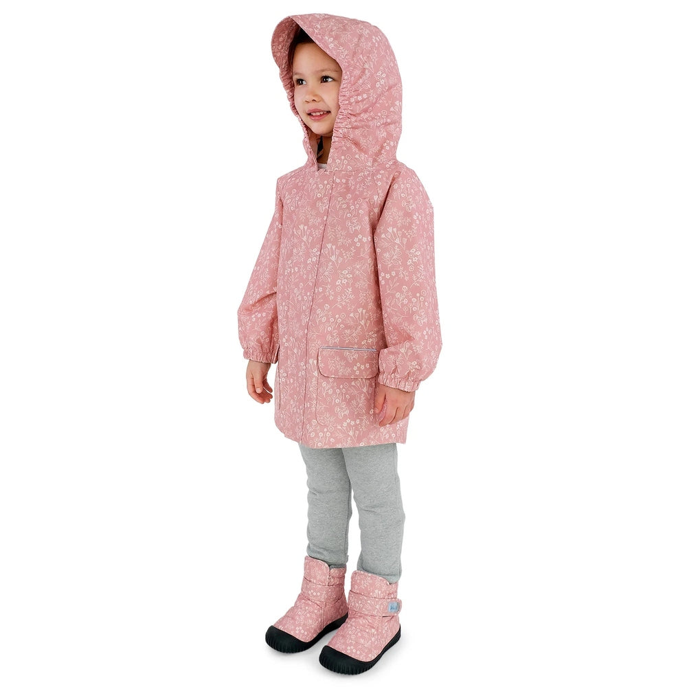 Jan & Jul Waterproof Puddle Dry Rain Jacket Prairie Flowers worn by a smiling child in pink floral hooded coat with front pocket.