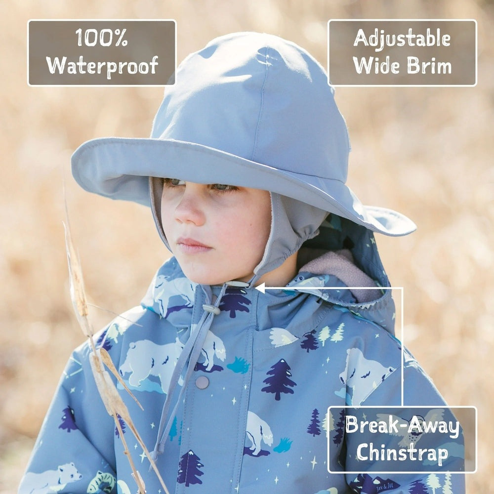 Jan & Jul dusty blue waterproof rain hat for toddlers with a wide brim and adjustable break-away chinstrap
