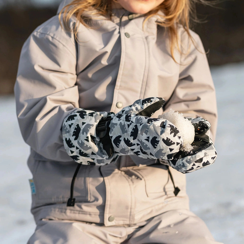 Jan & Jul Waterproof Toasty Dry Mitten Bear Cub toddler mittens in gray bear print, gripping a chunk of snow.