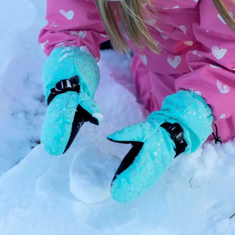 Jan & Jul Waterproof Toasty Dry Mitten Mint Star mittens; teal mittens with black palms worn by a child playing in the snow