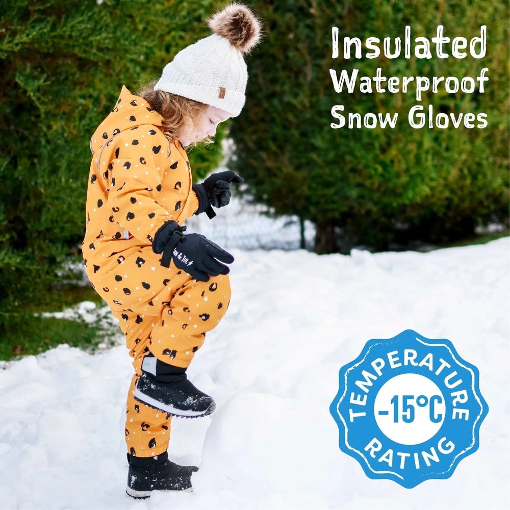 Jan & Jul Waterproof Toasty Dry Snow Gloves for toddlers; black gloves on a child jumping in the snow.