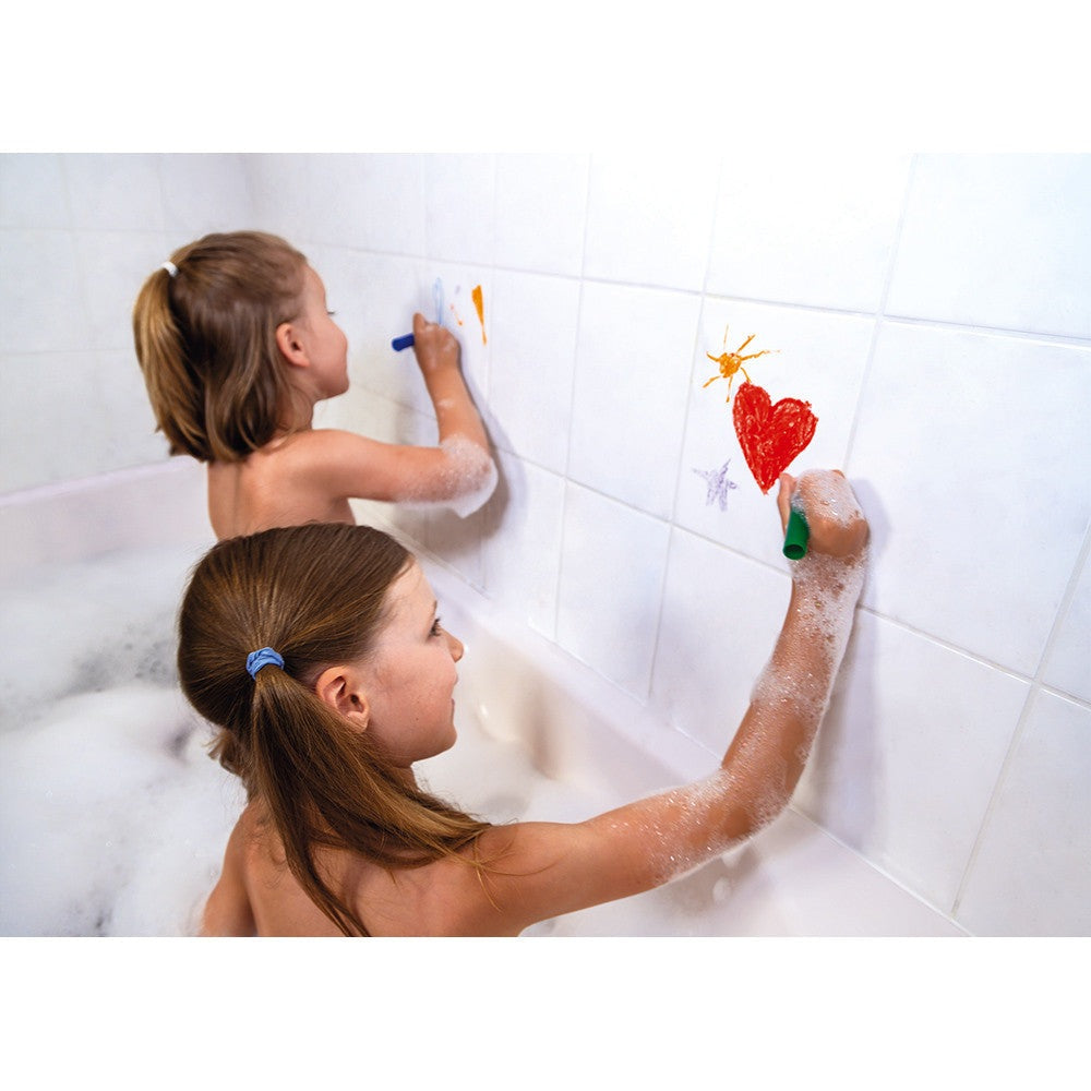 Janod Bath Coloring bath crayons; two children draw on white tiled wall with bright colors