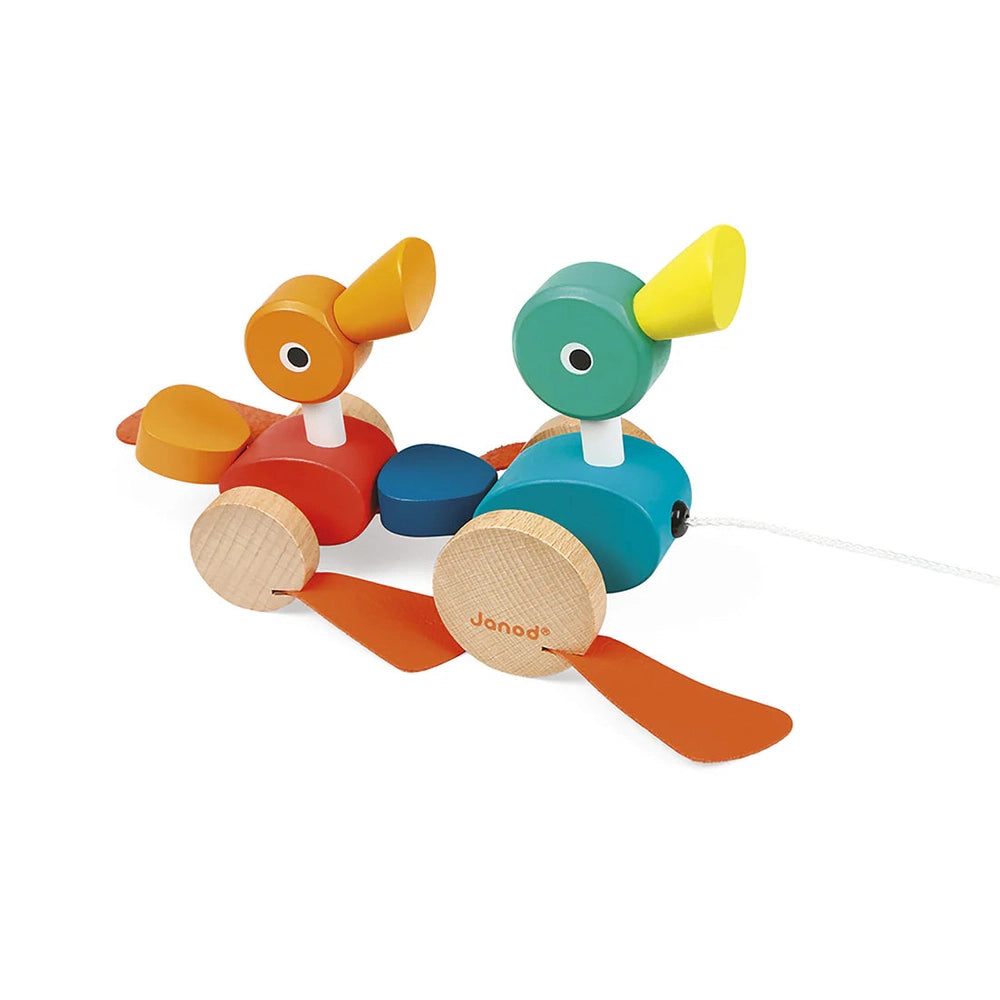 JANOD Zigolos Pull Along Ducks: two bright wooden ducks on wheels with a pulling cord.