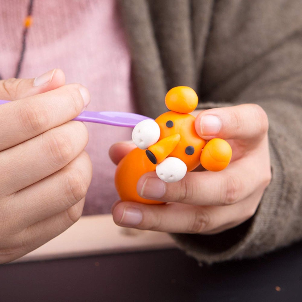 Jar Melo 7-piece play dough tool set; orange bear figure being sculpted with a purple tool