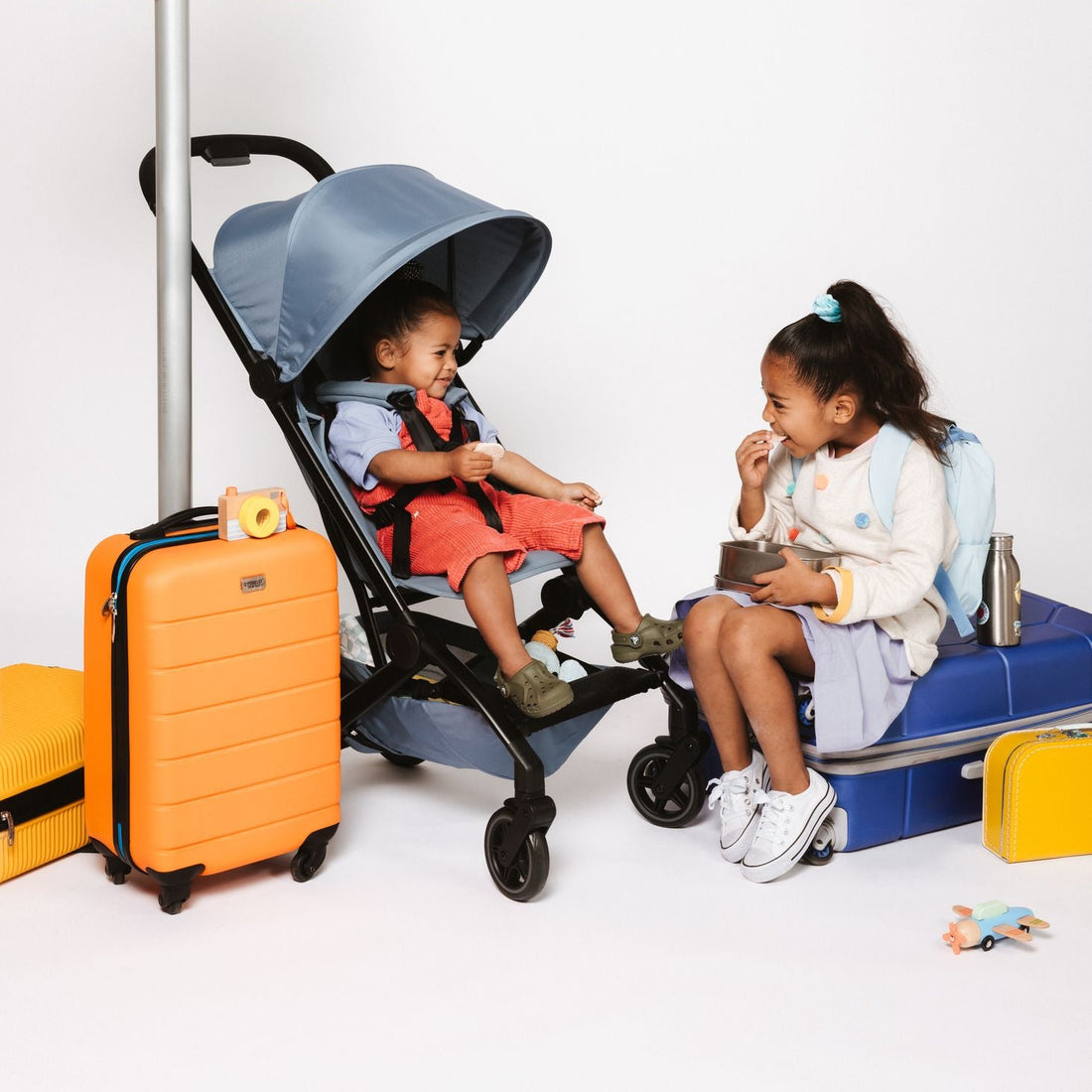Joolz Dot Lightweight Stroller - airport waiting scene with child in stroller