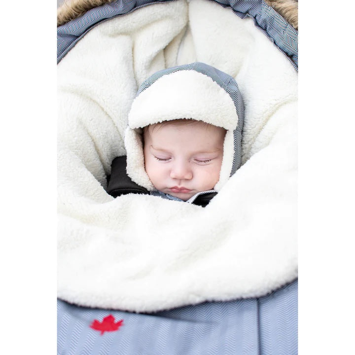 Juddlies infant car seat/stroller bag in salt-and-pepper grey with plush fleece lining, sleeping baby.