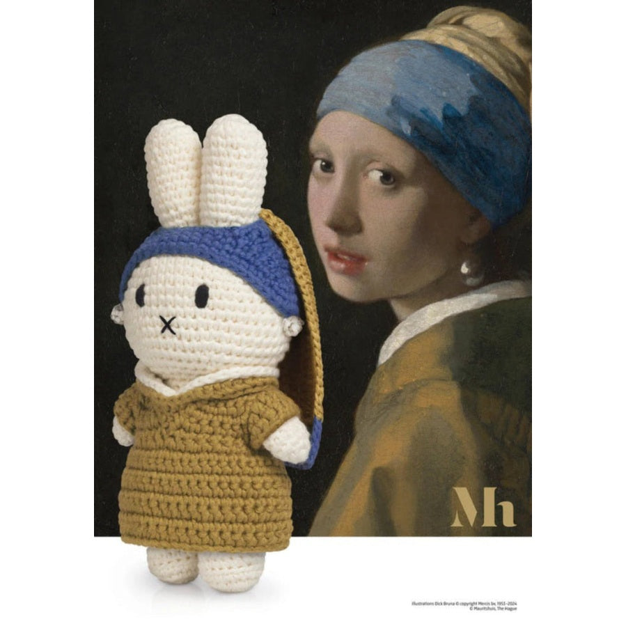 Just Dutch Miffy plush wearing a tan dress and blue headband, posed beside a Pearl Earring-inspired artwork.