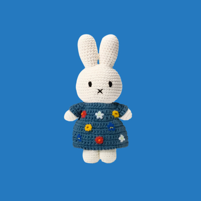 Just Dutch Miffy plush bunny in a blue crocheted dress with colorful flowers