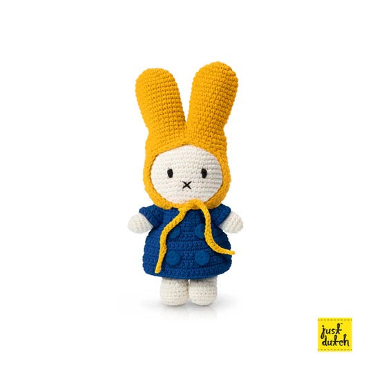 Just Dutch Miffy Winter Coat With Yellow Hat plush toy, yellow hood and blue coat, standing upright.