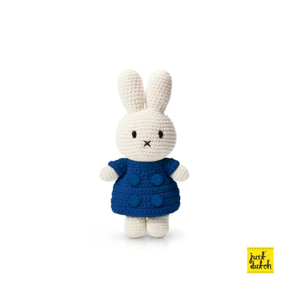 Just Dutch Miffy Winter Coat With Yellow Hat plush bunny stands upright in a blue crocheted coat.