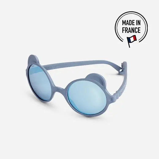 Ki Et La Sunglasses Ourson Silver Blue with round blue lenses and silver-blue frame, laid flat.