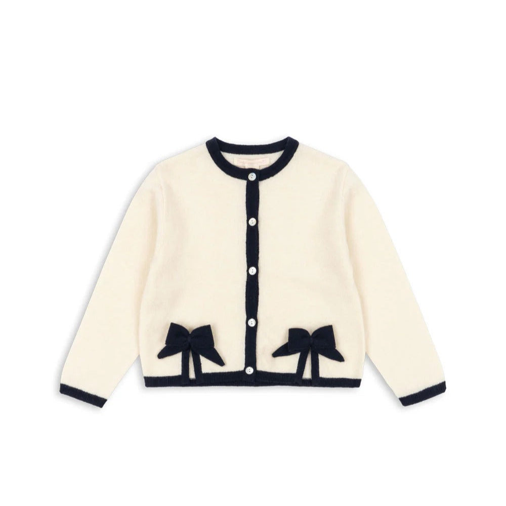 Konges Slojd Alette Cardigan Etoile cream cardigan with navy trim and two bow accents at hem, button-front