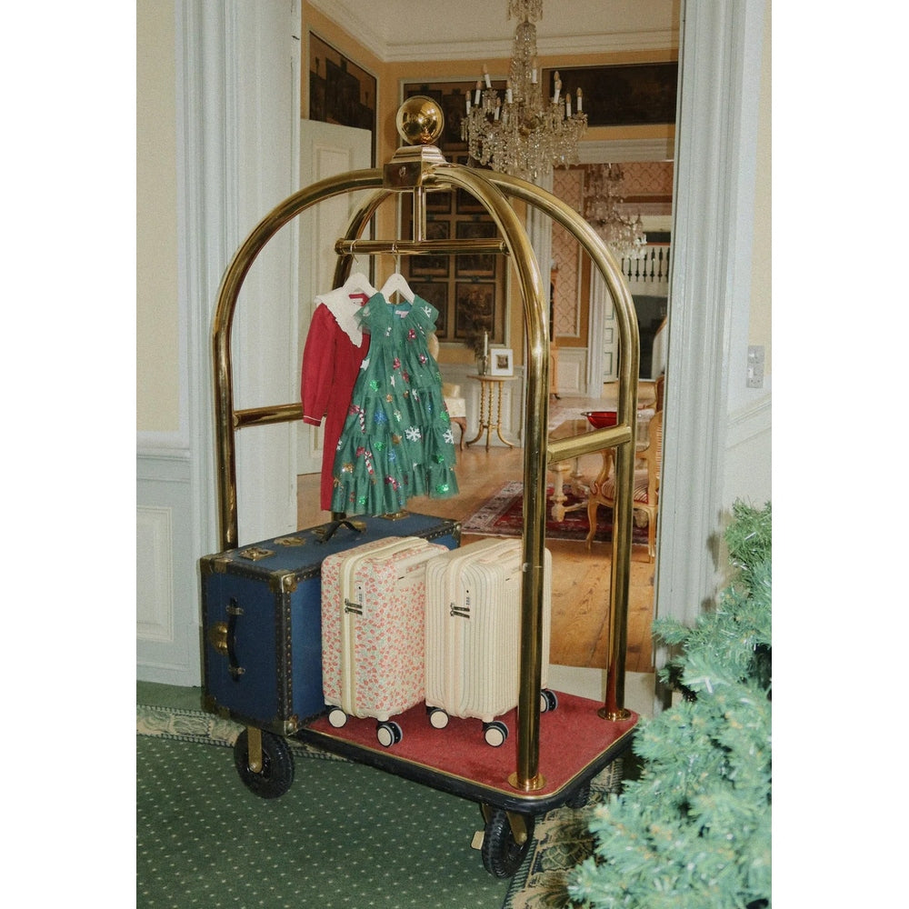 Konges Slojd Coeur Dress Red Dahlia on a hanger beside a green floral dress, displayed on vintage