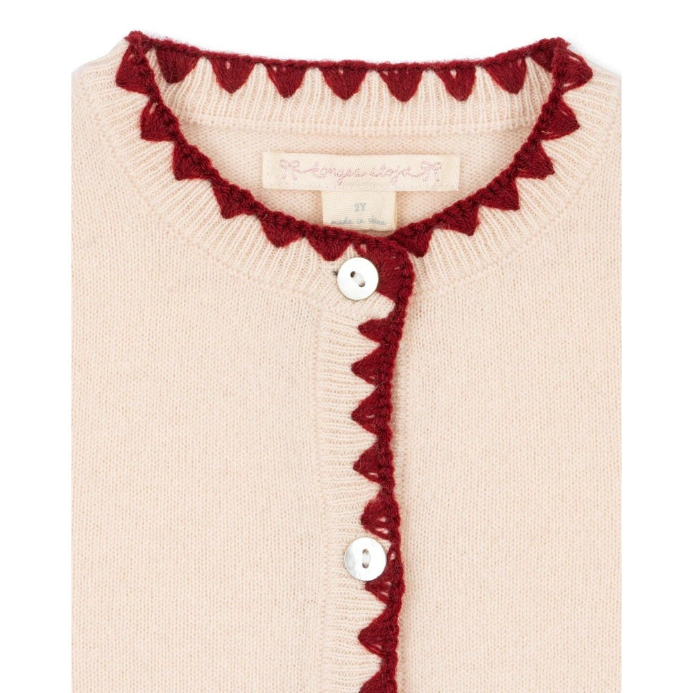 Konges Slojd Collette Cardigan Off White with burgundy scalloped trim along neckline and front buttons.
