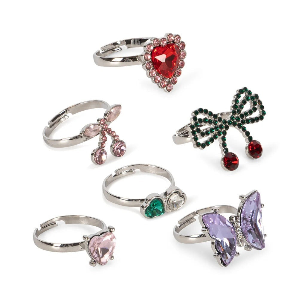 Konges Slojd Dreamy Ring Set 14 Pcs, assorted pastel gemstone rings on silver bands laid on white background