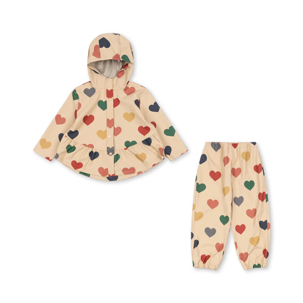 Konges Slojd Faire rain set: beige hooded raincoat with multicolor hearts and matching pants