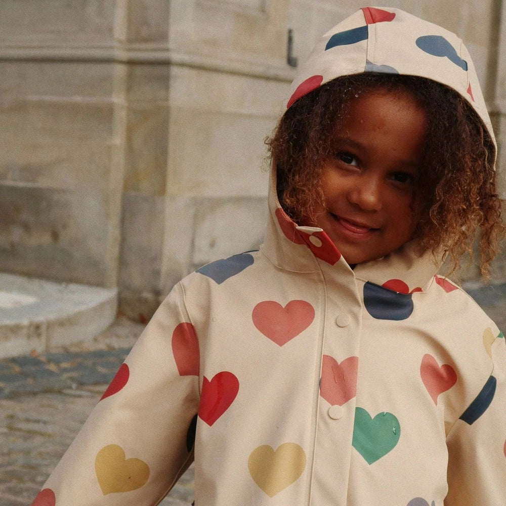Konges Slojd Faire rain coat for toddlers, cream with multicolor heart prints and hood