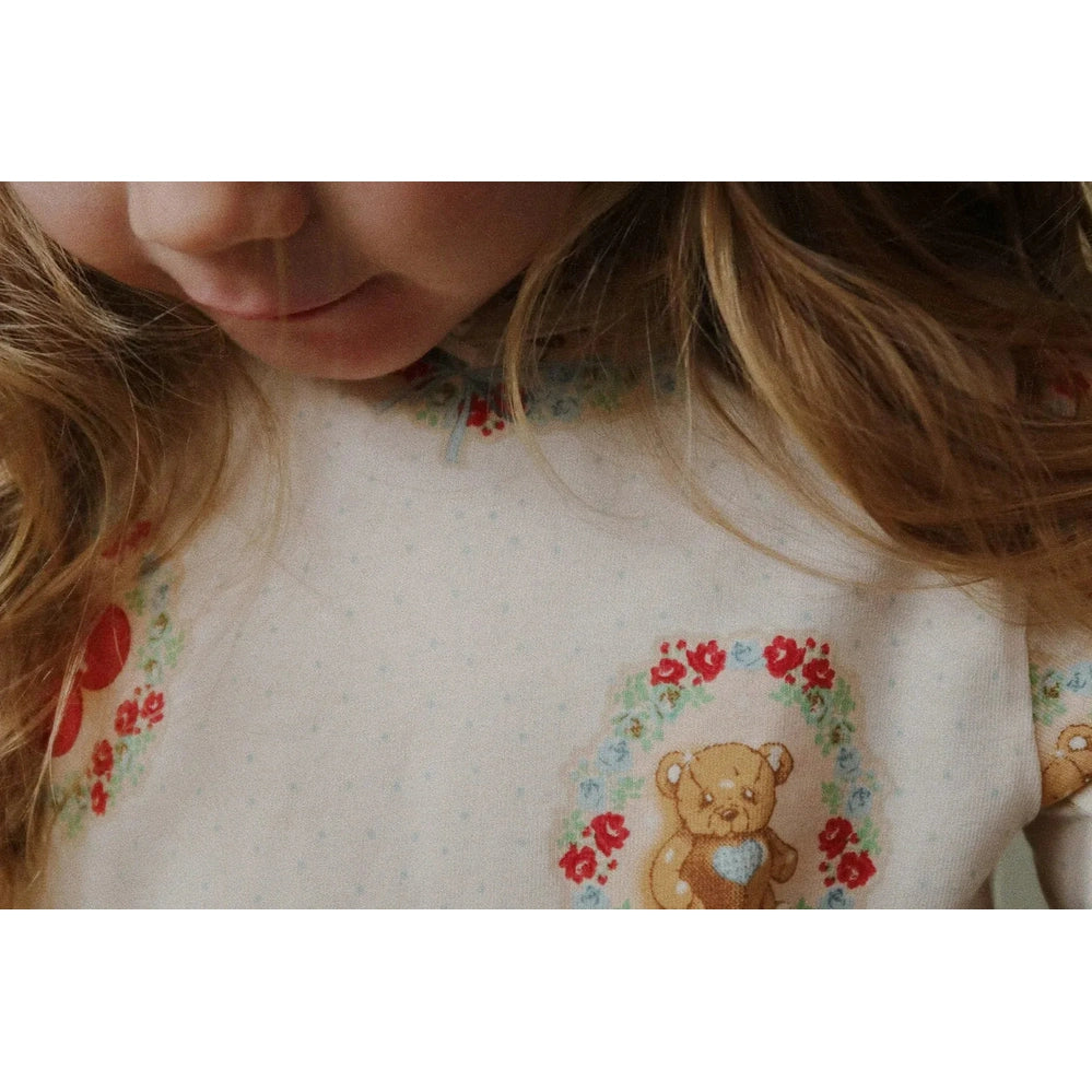 Konges Slojd Holiday Basic Blouse/Pants Set GOTS Deer Diary, toddler in cream knit top with teddy deer graphic.