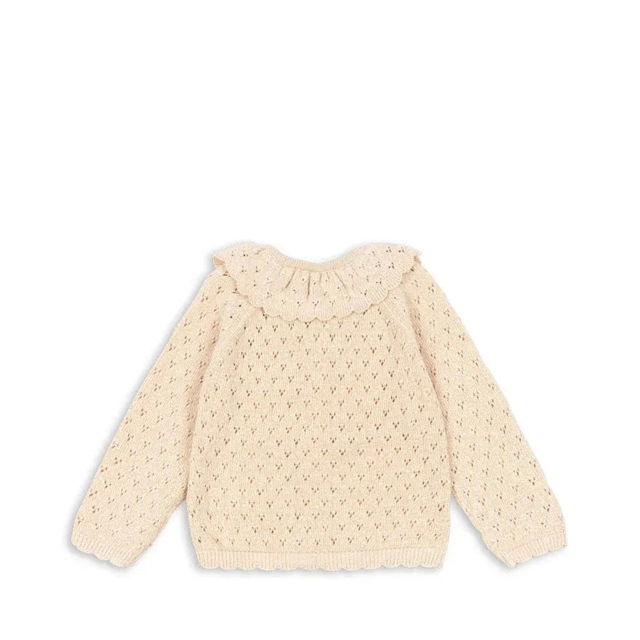 Konges Slojd Holiday Knit Cardigan Buttercream, cream knitted cardigan with a ruffled collar and scalloped hem.