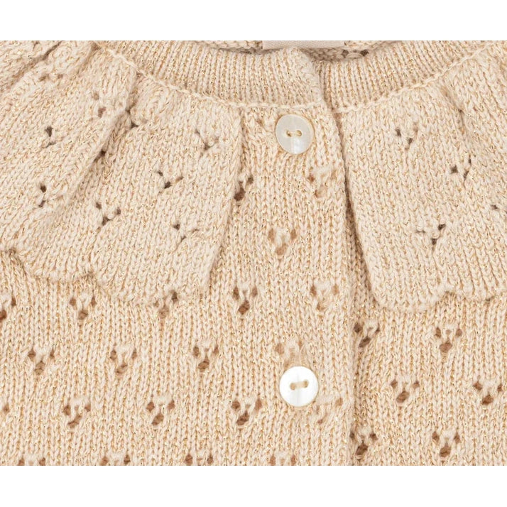 Konges Slojd Holiday Knit Cardigan Buttercream: front view of cream baby cardigan with white buttons and delicate eyelet knit.