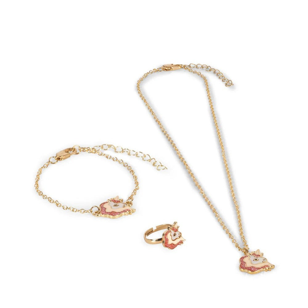 Konges Slojd Jewelry Set in gold-tone with pink unicorn pendants worn on wrist, neck, and finger.