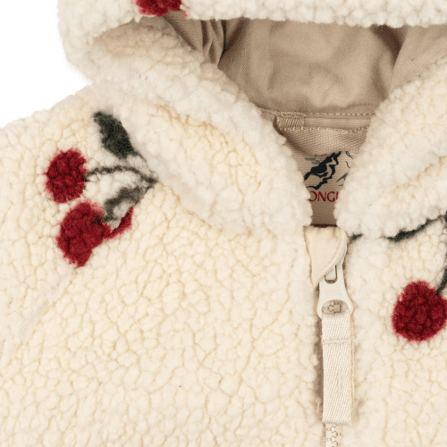 Konges Slojd Jody Teddy Onesie in cream sherpa with red cherry embroidery, zip-front baby outfit