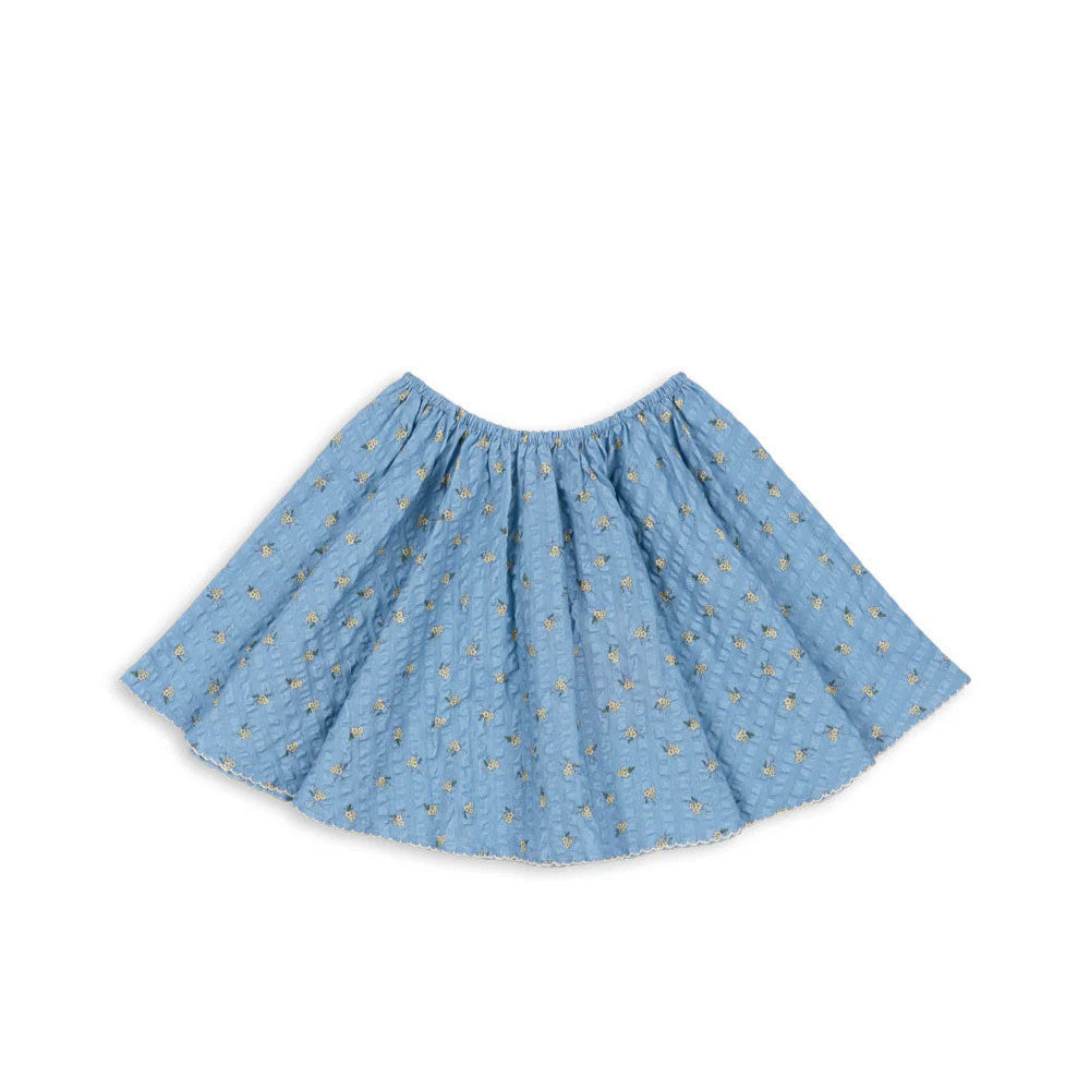 Konges Slojd Kim Skirt Billie Blue, elastic-waist baby skirt in light blue with tiny floral print.