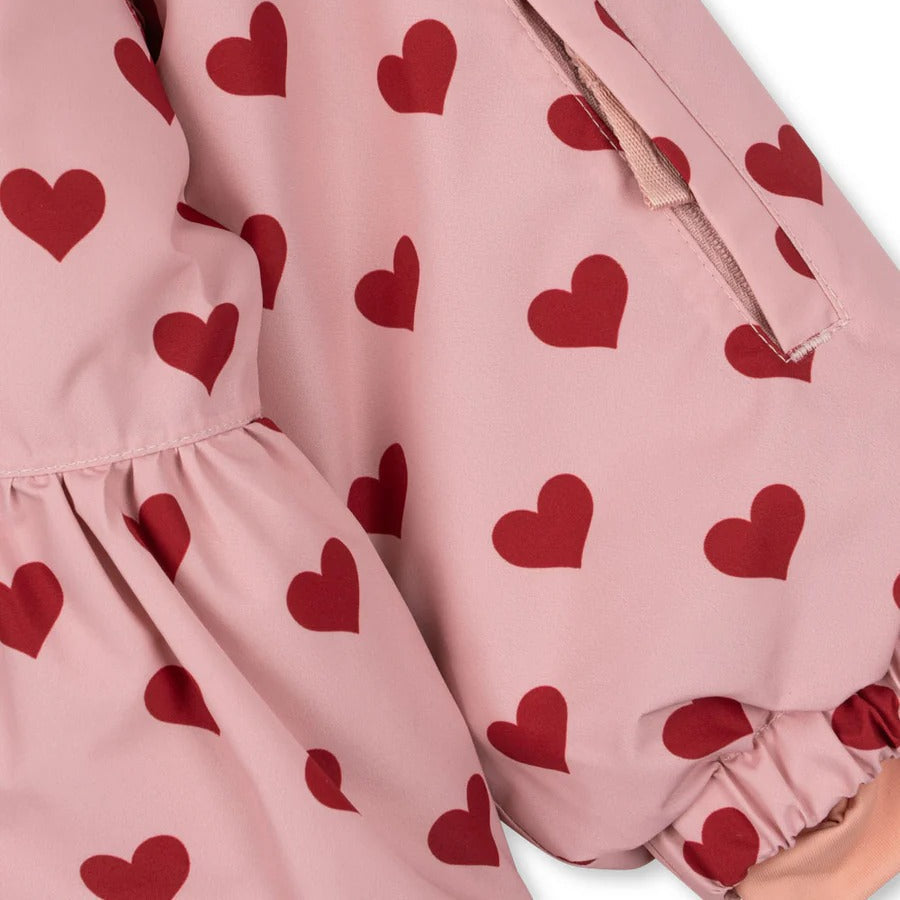Konges Slojd Mismou Jacket Amour Pink with red heart print, soft pink outerwear featuring elastic cuffs