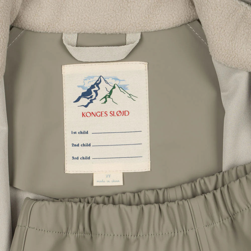 Konges Slojd Plainy Rain Set Laurel Oak rain coat, taupe exterior with grey lining