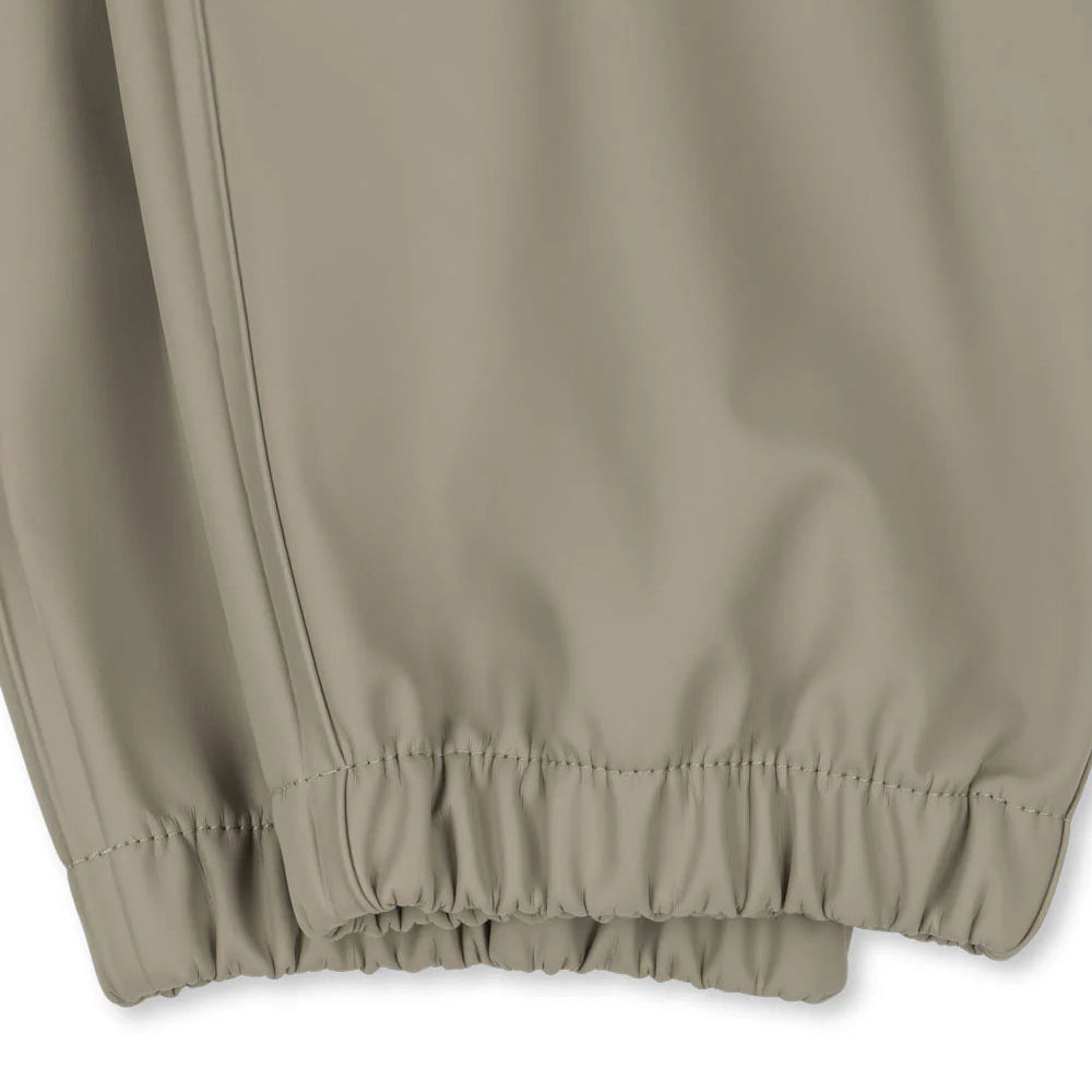 Konges Slojd Plainy Rain pants in Laurel Oak beige with elastic cuffs