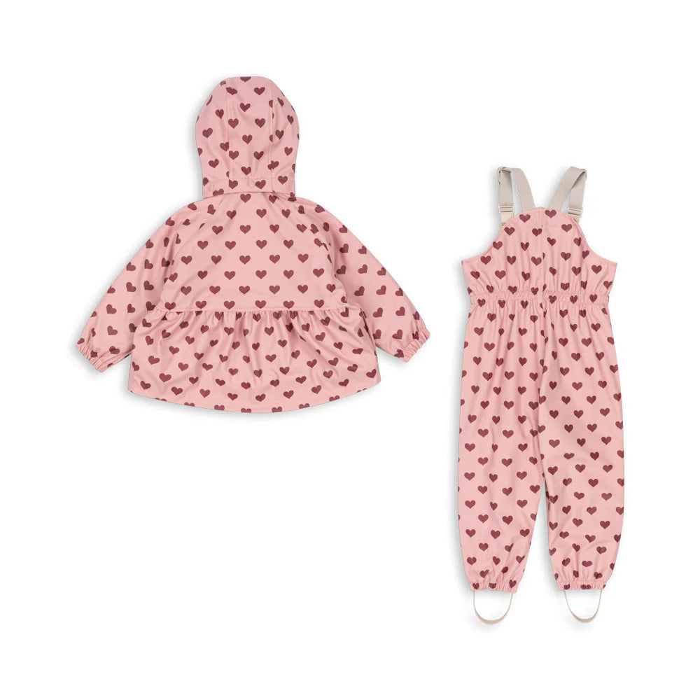Konges Slojd Rainy Palme Set Amour Pink: pink heart‑print hooded rain jacket with matching overalls for babies (2‑piece)