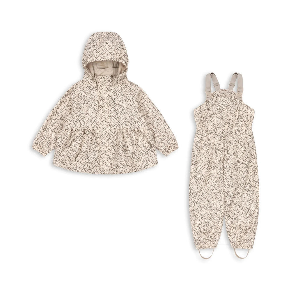 Konges Slojd Rainy Palme Set Milk Tank: beige dotted two-piece rain outfit with hooded jacket and matching suspenders pants.